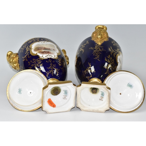 362 - A PAIR OF COALPORT COVERED VASES, of urn form with twin gilt ram's head handles, on a square pedesta... 