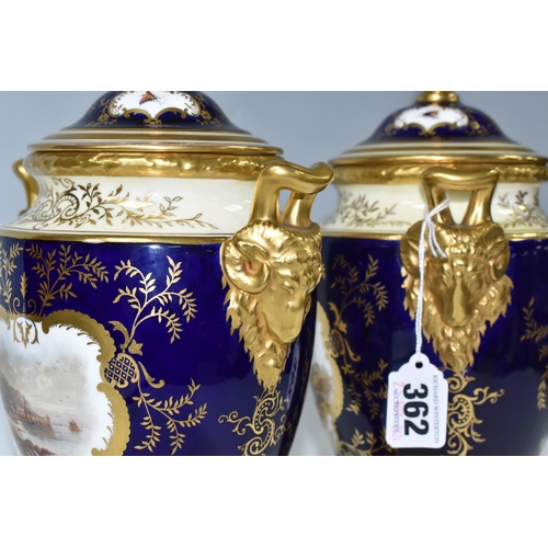 362 - A PAIR OF COALPORT COVERED VASES, of urn form with twin gilt ram's head handles, on a square pedesta... 