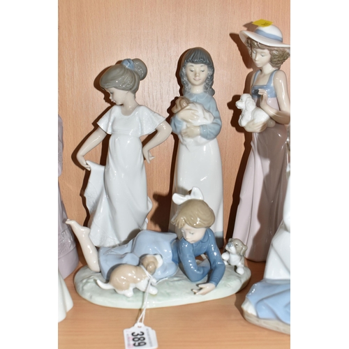 389 - A GROUP OF SEVEN LLADRO, NAO, AND SIMILAR FIGURES to include two Lladro figurines comprising 'Playfu... 