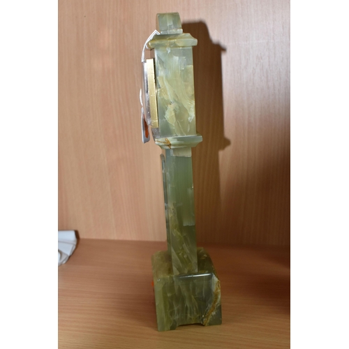 390 - A GREEN ONYX ORNAMENTAL MINIATURE 'SWIZA' CLOCK height 28cm, with a plastic bevel, Arabic numerals t... 