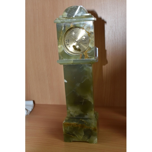 390 - A GREEN ONYX ORNAMENTAL MINIATURE 'SWIZA' CLOCK height 28cm, with a plastic bevel, Arabic numerals t... 