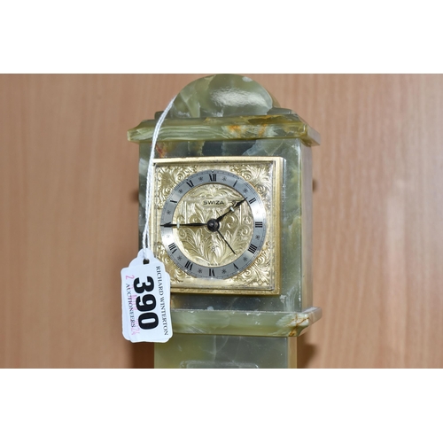 390 - A GREEN ONYX ORNAMENTAL MINIATURE 'SWIZA' CLOCK height 28cm, with a plastic bevel, Arabic numerals t... 