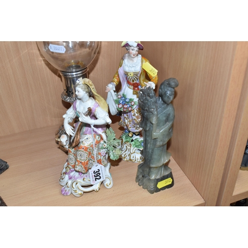 392 - A NEPHRITE FIGURE OF GUANYIN, A PLATED CANDLESTICK, AND TWO CONTINENTAL FIGURES, to include a hand-c... 