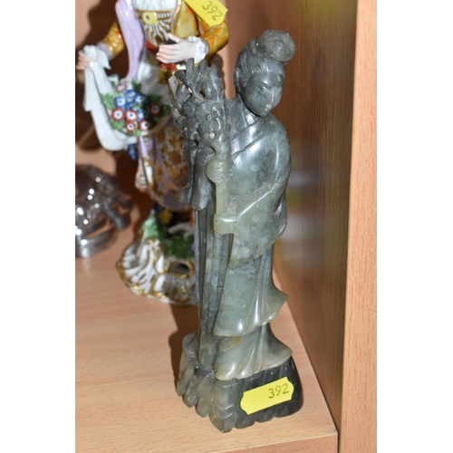 392 - A NEPHRITE FIGURE OF GUANYIN, A PLATED CANDLESTICK, AND TWO CONTINENTAL FIGURES, to include a hand-c... 