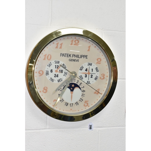 398 - A DISPLAY WALL CLOCK with a printed clock face marked 'Patek Philippe Geneve Swiss Made' with printe... 