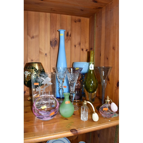 400 - A GROUP OF MIXED MOSTLY COLOURED GLASSWARE to include a pair of crystal cut wine glasses, a blue cas... 