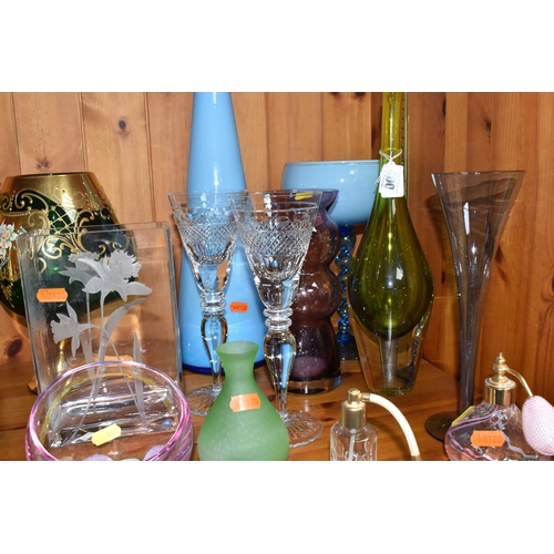 400 - A GROUP OF MIXED MOSTLY COLOURED GLASSWARE to include a pair of crystal cut wine glasses, a blue cas... 