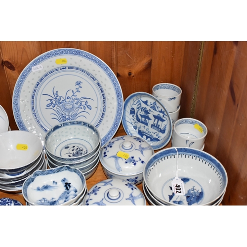 402 - A LARGE QUANTITY OF BLUE AND WHITE MOSTLY CHINESE CERAMICS to include three blue and white bowls wit... 