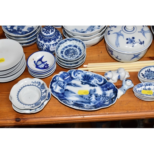 402 - A LARGE QUANTITY OF BLUE AND WHITE MOSTLY CHINESE CERAMICS to include three blue and white bowls wit... 