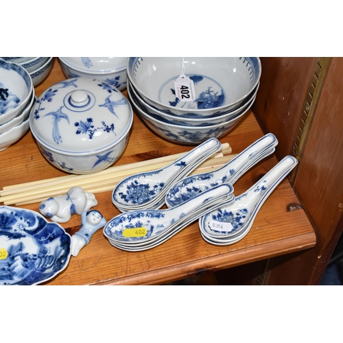 402 - A LARGE QUANTITY OF BLUE AND WHITE MOSTLY CHINESE CERAMICS to include three blue and white bowls wit... 