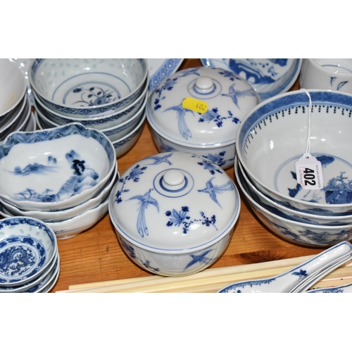 402 - A LARGE QUANTITY OF BLUE AND WHITE MOSTLY CHINESE CERAMICS to include three blue and white bowls wit... 