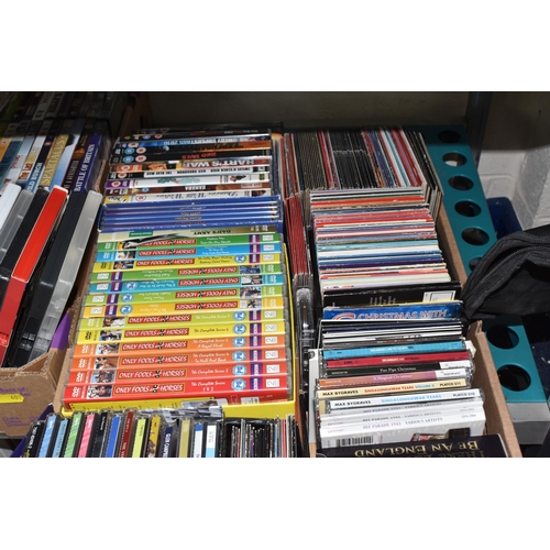 409 - FOUR BOXES OF CDS AND DVDS to include two boxes of approximately fifty DVDS comprising various war, ... 