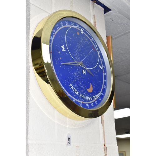 427 - A DISPLAY WALL CLOCK, printed 'Patek Philippe Geneve', the face printed with Arabic numerals 1-31, p... 