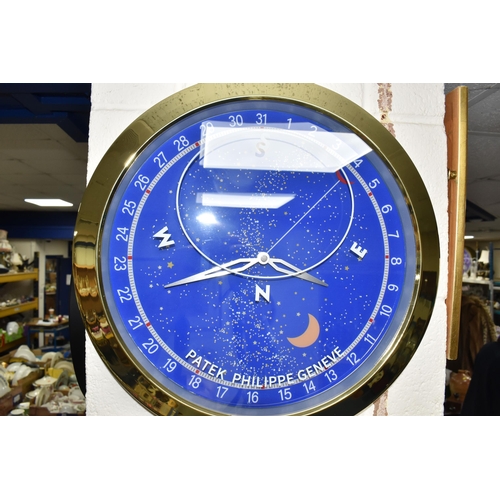 427 - A DISPLAY WALL CLOCK, printed 'Patek Philippe Geneve', the face printed with Arabic numerals 1-31, p... 