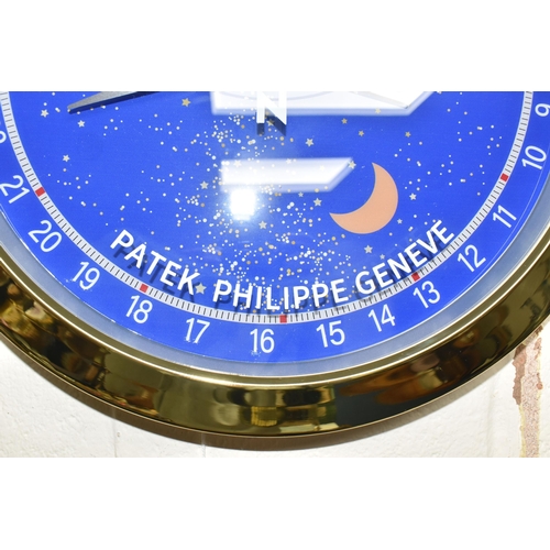 427 - A DISPLAY WALL CLOCK, printed 'Patek Philippe Geneve', the face printed with Arabic numerals 1-31, p... 