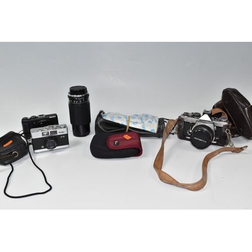 441 - A BOX OF CAMERAS, comprising a cased Olympus OM-2, fitted with an Olympus f1.8 50mm lens, a cased To... 