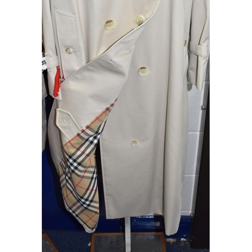 485 - A LADIES' BURBERRY'S TRENCH COAT, HAT YSL UMBRELLA AND AN AQUASCUTUM QUILTED JACKET, comprising a be... 