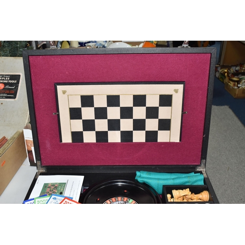 499 - A K & C LTD BOX SET OF TABLE GAMES comprising a roulette wheel, dominoes, chess pieces, draughts pie... 