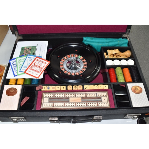 499 - A K & C LTD BOX SET OF TABLE GAMES comprising a roulette wheel, dominoes, chess pieces, draughts pie... 