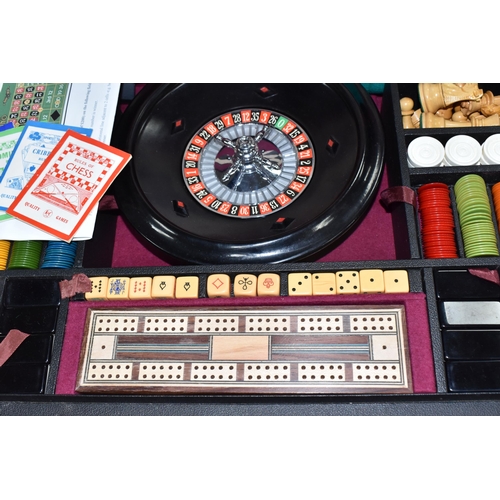 499 - A K & C LTD BOX SET OF TABLE GAMES comprising a roulette wheel, dominoes, chess pieces, draughts pie... 