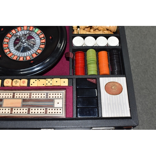 499 - A K & C LTD BOX SET OF TABLE GAMES comprising a roulette wheel, dominoes, chess pieces, draughts pie... 