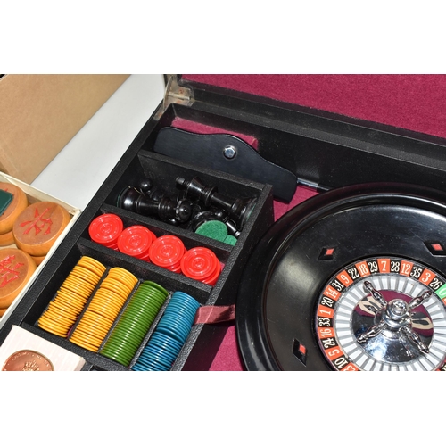 499 - A K & C LTD BOX SET OF TABLE GAMES comprising a roulette wheel, dominoes, chess pieces, draughts pie... 