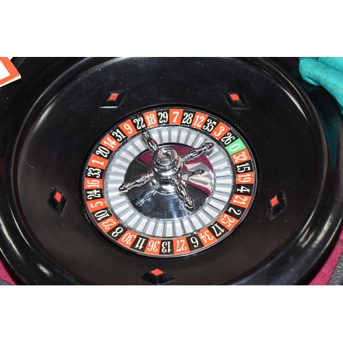 499 - A K & C LTD BOX SET OF TABLE GAMES comprising a roulette wheel, dominoes, chess pieces, draughts pie... 