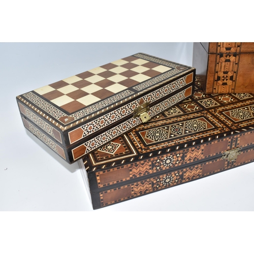 505 - TWO MIDDLE EASTERN BACKGAMMON BOARDS, comprising a large 1970's inlaid games box with chess board to... 