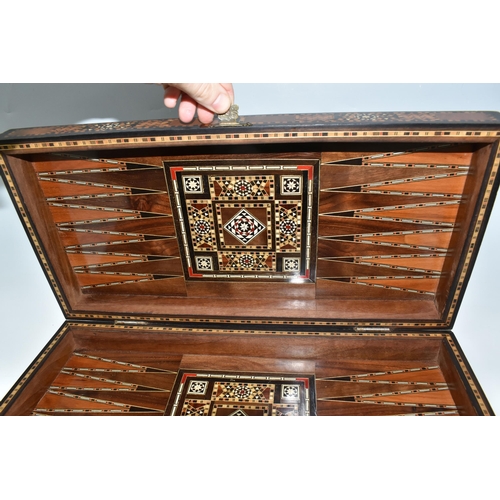 505 - TWO MIDDLE EASTERN BACKGAMMON BOARDS, comprising a large 1970's inlaid games box with chess board to... 