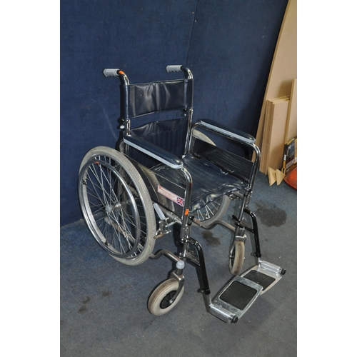 1069 - A WHEELCHAIRS UK FOLDING WHEELCHAIR with two footrests