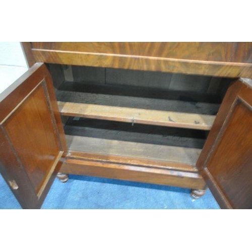 1197 - A VICTORIAN MAHOGANY ESCRITOIRE, with a single drawer, the fall front door enclosing a fitted interi... 