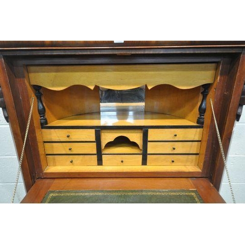 1197 - A VICTORIAN MAHOGANY ESCRITOIRE, with a single drawer, the fall front door enclosing a fitted interi... 