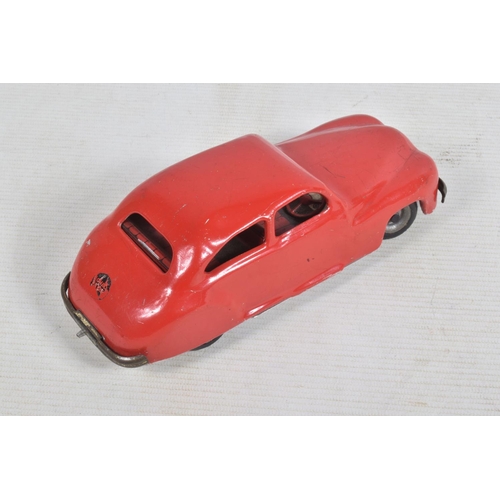 22 - AN UNBOXED CHAD VALLEY TINPLATE CLOCKWORK CAR, red body, black and red interior, with reg. no. CV100... 