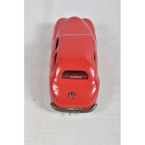 22 - AN UNBOXED CHAD VALLEY TINPLATE CLOCKWORK CAR, red body, black and red interior, with reg. no. CV100... 