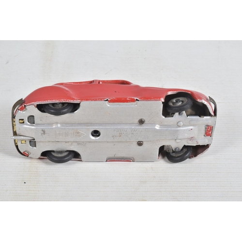 22 - AN UNBOXED CHAD VALLEY TINPLATE CLOCKWORK CAR, red body, black and red interior, with reg. no. CV100... 