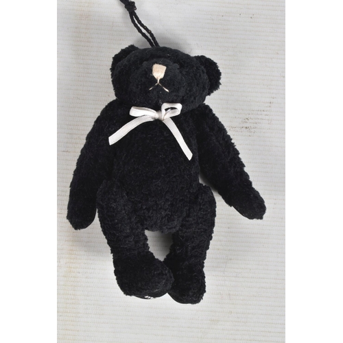 23 - AN UNBOXED MODERN STEIFF BEAR, No.029561, complete with button and yellow tag to left ear and in ver... 