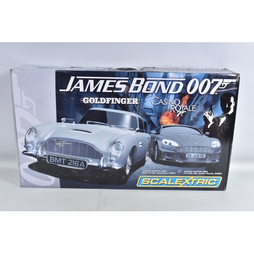 107 - THREE BOXED RACING KITS, to include a Scalextric James Bond 007  Aston Martin DB5 v Aston Martin DBS... 