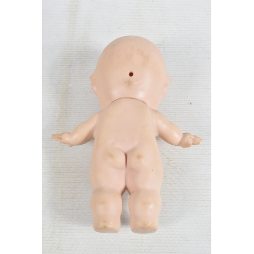 71 - THREE VINYL KEWPIE DOLLS, smallest one marked  'M350? Combex Made in England' to base, other two hav... 