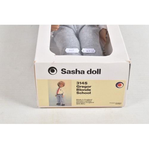 73 - A BOXED TRENDON SASHA DOLL 'Gregor' in School uniform, No.314S, blonde hair, white shirt, red tie an... 