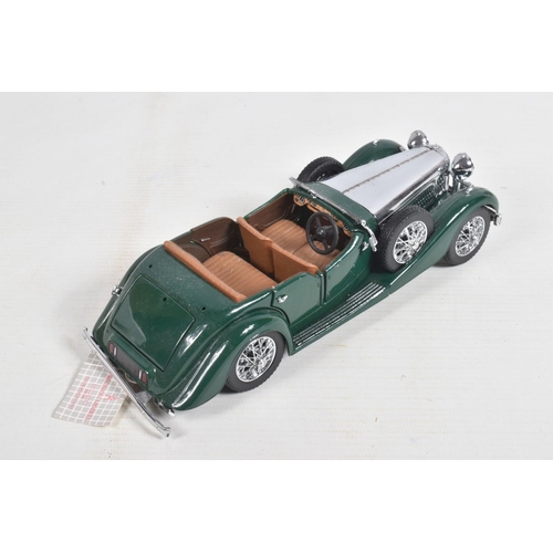 82 - FOUR DANBURY MINT AND  FRANKLIN MINT DIECAST MODEL CARS,  to include a Franklin Mint Jaguar SS-100 w... 