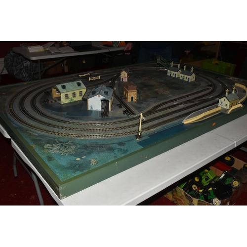 160 - A OO GAUGE MODEL RAILWAY LAYOUT, hardboard base supported on timber battens and edged in timber to w... 