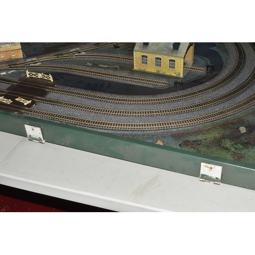 160 - A OO GAUGE MODEL RAILWAY LAYOUT, hardboard base supported on timber battens and edged in timber to w... 