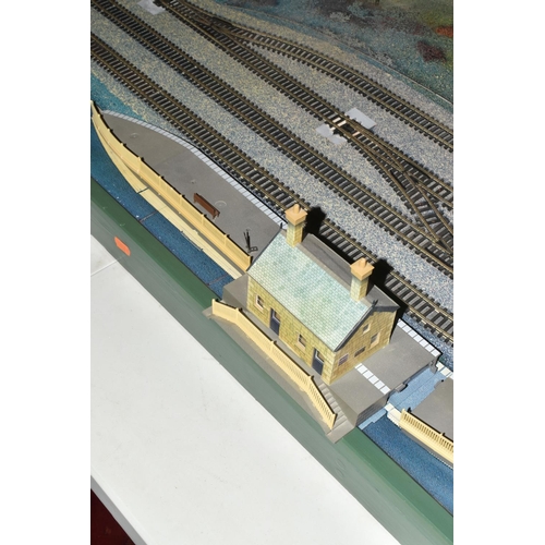 160 - A OO GAUGE MODEL RAILWAY LAYOUT, hardboard base supported on timber battens and edged in timber to w... 