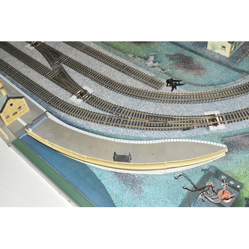 160 - A OO GAUGE MODEL RAILWAY LAYOUT, hardboard base supported on timber battens and edged in timber to w... 