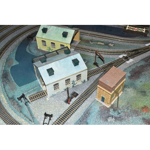 160 - A OO GAUGE MODEL RAILWAY LAYOUT, hardboard base supported on timber battens and edged in timber to w... 