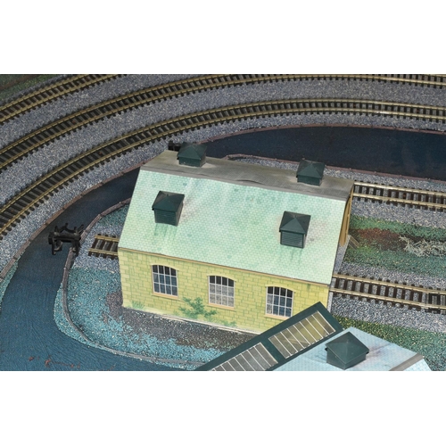 160 - A OO GAUGE MODEL RAILWAY LAYOUT, hardboard base supported on timber battens and edged in timber to w... 