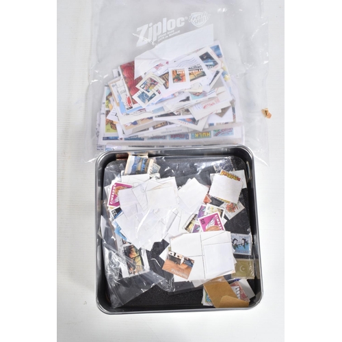 220 - LARGE COLLECTION OF STAMPS IN 2 BOXES, A TIN AND 2 BAGS. WORLDWIDE CONTENT WITH MAIN VALUE IN GB MIN... 