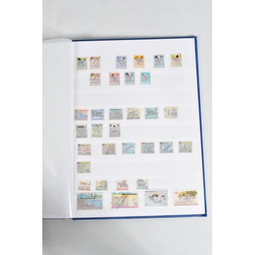 220 - LARGE COLLECTION OF STAMPS IN 2 BOXES, A TIN AND 2 BAGS. WORLDWIDE CONTENT WITH MAIN VALUE IN GB MIN... 