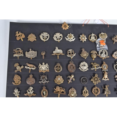 267 - A COLLECTION OF OVER ONE HUNDRED CAP AND COLLAR BADGES FROM VARIOUS ERAS OF THE 20TH CENTURY, this v... 