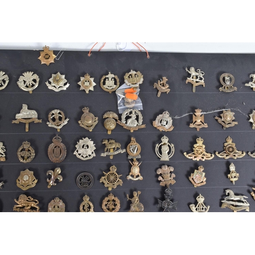 267 - A COLLECTION OF OVER ONE HUNDRED CAP AND COLLAR BADGES FROM VARIOUS ERAS OF THE 20TH CENTURY, this v... 